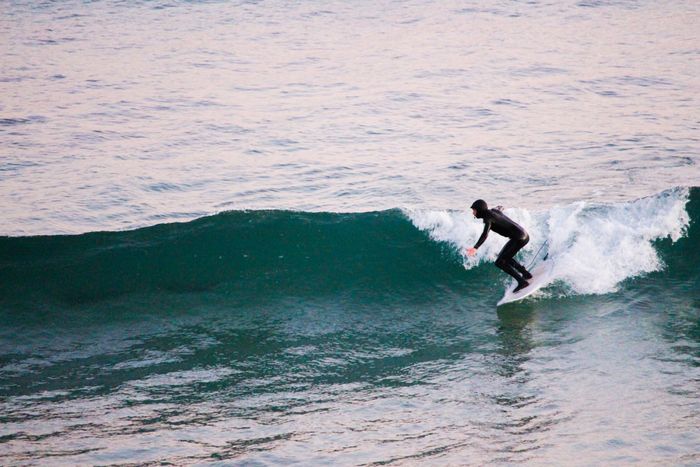 Exciting surfing action at Anglesea Beach with clear waves and an adventurous surfer.
