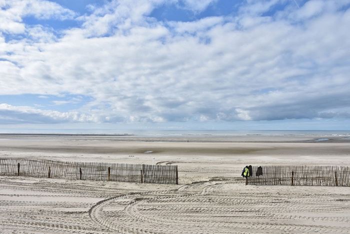 Beautiful sandy beach with cloudy sky at Le Touquet-Paris-Plage in France.