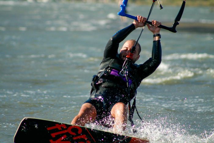 Exciting kiteboarding action captured in Akyaka, with a sports enthusiast navigating the waves.