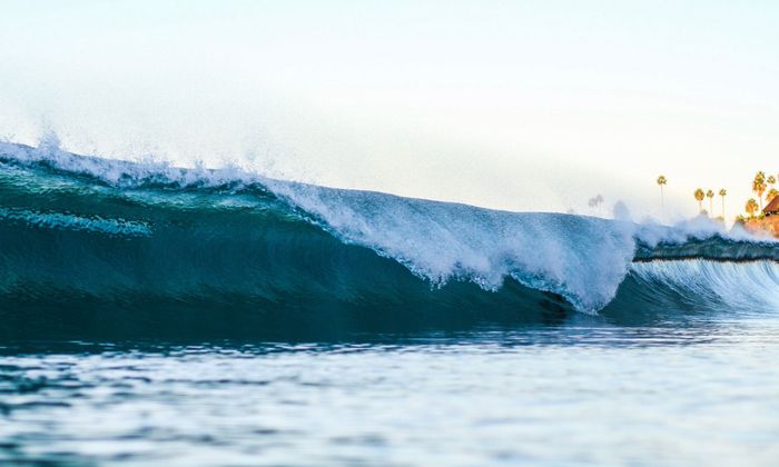 Capture of a powerful wave crashing at Laguna Beach, ideal for nature and travel themes.