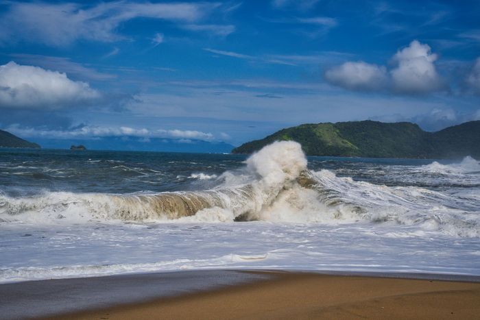 Experience the powerful waves crashing on the pristine beach of Ubatuba, Brazil.