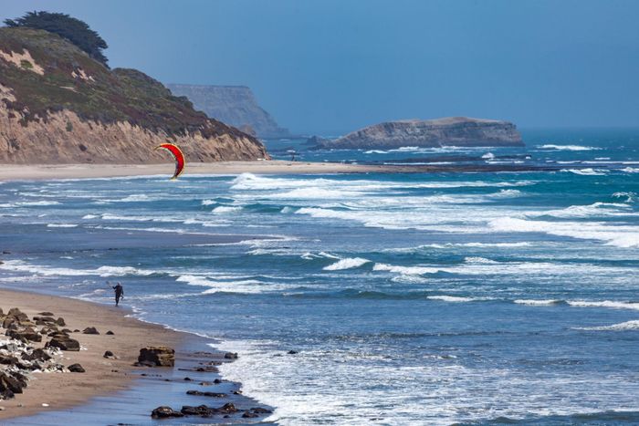 Exciting kitesurfing scene along the stunning coastline of California, USA.