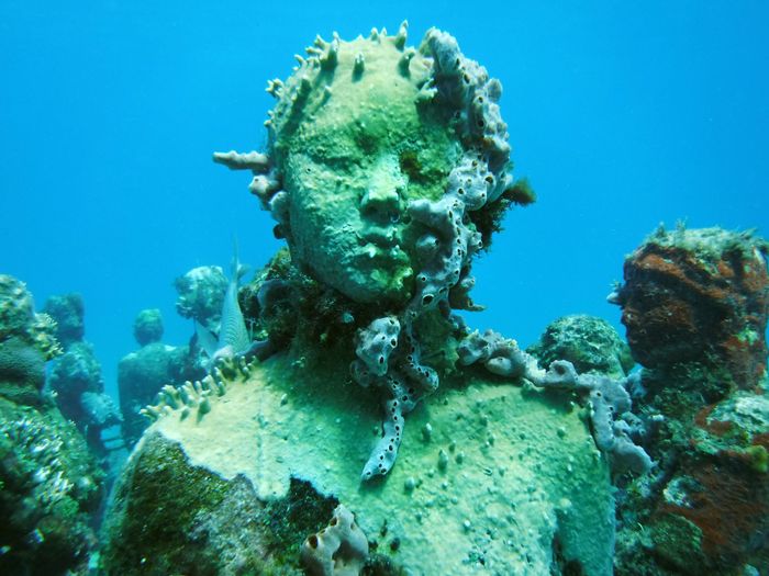A detailed view of a marine-encrusted sculpture at Cancun's Underwater Museum, Quintana Roo.