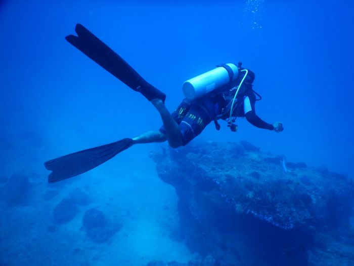 Scuba diver exploring underwater depths, capturing marine adventure vibes.