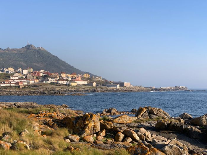 A picturesque coastal village in Northern Portugal with ocean views and rocky shoreline.