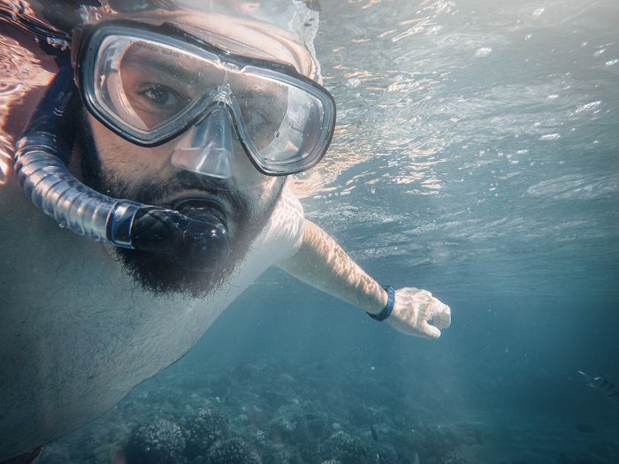 Man snorkeling underwater in Egypt, showcasing marine exploration and adventure.