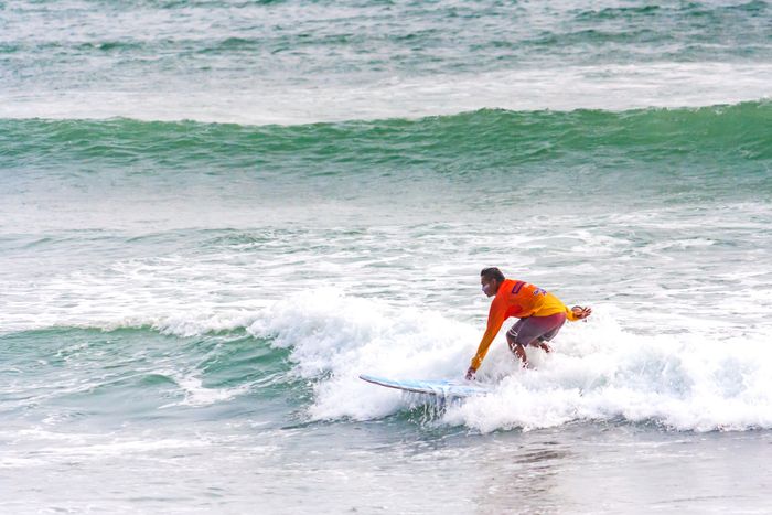 Experience the thrill of surfing in Callao, Lima, captured in vibrant action.