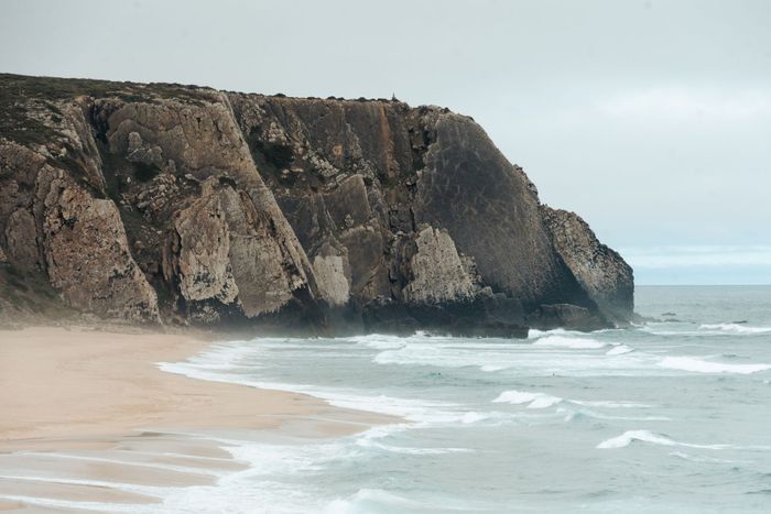 Experience the dramatic cliffs and serene waves at Ursa Beach, Portugal's hidden gem.